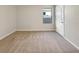 Bright bedroom with neutral carpeting and a window at 309 Gina Ln, Davenport, FL 33837
