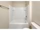 Bathroom with a shower/tub combo and tile surround at 309 Gina Ln, Davenport, FL 33837