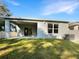 Covered patio with view of a grassy backyard at 309 Gina Ln, Davenport, FL 33837