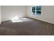 Empty bedroom with carpeted floor and large window at 309 Gina Ln, Davenport, FL 33837