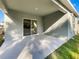 Covered back patio with sliding glass door access at 309 Gina Ln, Davenport, FL 33837