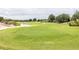 View of a beautifully landscaped golf course at 7582 Assembly Ln, Reunion, FL 34747