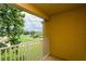 Private balcony overlooking a lush golf course at 7582 Assembly Ln, Reunion, FL 34747