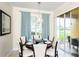 Bright dining room with seating for six and sliding glass doors to patio at 7582 Assembly Ln, Reunion, FL 34747