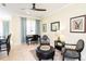 Sitting area with zebra print chairs and ottoman at 7582 Assembly Ln, Reunion, FL 34747