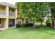 Ground-level view of the home's exterior and surrounding landscape at 7582 Assembly Ln, Reunion, FL 34747