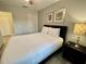 Guest bedroom with a queen-size bed and lots of natural light at 7582 Assembly Ln, Reunion, FL 34747