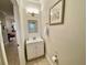 Clean and modern half bathroom with updated vanity at 7582 Assembly Ln, Reunion, FL 34747