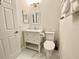 Simple bathroom with a toilet and sink at 7582 Assembly Ln, Reunion, FL 34747