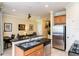 Well-equipped kitchen boasts granite countertops and ample cabinetry at 7582 Assembly Ln, Reunion, FL 34747