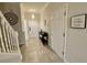 Bright and spacious entryway with staircase and console table at 7582 Assembly Ln, Reunion, FL 34747
