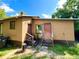 Rear view of the house with a red door at 716 Columbia St, Orlando, FL 32805