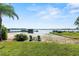 Relaxing lakefront view with sandy beach and chairs at 4205 Waterfront Pkwy, Orlando, FL 32806