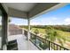 Private balcony overlooking a golf course and lush landscape at 1169 Castle Pines Ct, Reunion, FL 34747