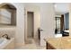 Elegant bathroom with a soaking tub and walk-in shower at 1169 Castle Pines Ct, Reunion, FL 34747