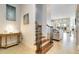 Elegant staircase leading to the upper level of the home at 1169 Castle Pines Ct, Reunion, FL 34747