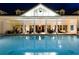 Night view of resort-style pool and clubhouse at 1169 Castle Pines Ct, Reunion, FL 34747