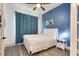 Bright bedroom with a queen-size bed and plenty of natural light at 1169 Castle Pines Ct, Reunion, FL 34747