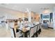 Open concept kitchen and dining area with stainless steel appliances and large island at 1169 Castle Pines Ct, Reunion, FL 34747