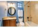Well-appointed bathroom with granite vanity, shower/tub combo, and updated fixtures at 1169 Castle Pines Ct, Reunion, FL 34747