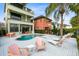 Resort-style pool and spa with patio furniture and seating at 1169 Castle Pines Ct, Reunion, FL 34747