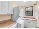 Convenient laundry room with stackable washer and dryer at 1169 Castle Pines Ct, Reunion, FL 34747