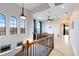 Upstairs hallway with access to bedrooms and a sitting area at 1169 Castle Pines Ct, Reunion, FL 34747