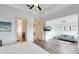 Main bedroom with king-size bed, sitting area and access to the bathroom and hallway at 1169 Castle Pines Ct, Reunion, FL 34747