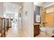 Clean bathroom with tub, toilet, and vanity at 1169 Castle Pines Ct, Reunion, FL 34747