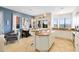 Open concept kitchen with island, white cabinets, and granite countertops at 1169 Castle Pines Ct, Reunion, FL 34747