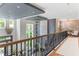 Open upper landing overlooking the main living area with a modern design at 5121 Latrobe Dr, Windermere, FL 34786