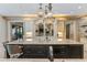 Modern kitchen with large island, custom cabinetry, and stone countertops at 5121 Latrobe Dr, Windermere, FL 34786