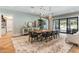 Bright dining room with live edge table and access to backyard and pool at 5121 Latrobe Dr, Windermere, FL 34786