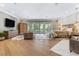 Luxurious main bedroom featuring hardwood floors, a sitting area, and large windows at 5121 Latrobe Dr, Windermere, FL 34786