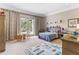 Cheerful bedroom with playful decor and access to a private balcony at 5121 Latrobe Dr, Windermere, FL 34786