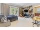 Spacious bedroom with built-in shelving, a desk, and access to balcony at 5121 Latrobe Dr, Windermere, FL 34786