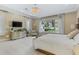 Serene main bedroom with ample space and views of the backyard at 5121 Latrobe Dr, Windermere, FL 34786