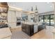 Gourmet kitchen with island, stainless steel appliances, and view to backyard at 5121 Latrobe Dr, Windermere, FL 34786