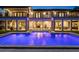 Luxury home with a beautiful pool at night at 5121 Latrobe Dr, Windermere, FL 34786