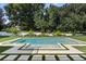 Inviting rectangular pool with fountain and landscaping at 5121 Latrobe Dr, Windermere, FL 34786