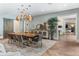 Elegant dining room features a live-edge table and modern lighting at 5121 Latrobe Dr, Windermere, FL 34786