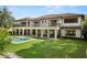 Stunning backyard oasis with a large pool, expansive lawn, and mature trees at 5121 Latrobe Dr, Windermere, FL 34786