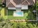 Modern home with a clean-lined pool and lush landscaping at 5121 Latrobe Dr, Windermere, FL 34786
