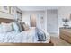 Main bedroom with large bed and access to the bathroom and walk-in closet at 2563 Sage Valley Way, Winter Haven, FL 33884