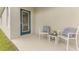 Private patio with comfortable seating and view to backyard at 2563 Sage Valley Way, Winter Haven, FL 33884