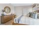 Main bedroom with large bed, dresser, and plenty of natural light at 2563 Sage Valley Way, Winter Haven, FL 33884