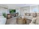 Relaxing living room, featuring a large TV, comfortable seating, and stylish decor at 2563 Sage Valley Way, Winter Haven, FL 33884