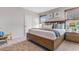 Spacious main bedroom with a large bed, ample closet space, and plenty of natural light at 2563 Sage Valley Way, Winter Haven, FL 33884