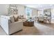 Spacious living room with open floor plan, featuring a neutral color palette and ample natural light at 2563 Sage Valley Way, Winter Haven, FL 33884