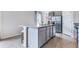 Kitchen island with granite countertop and seating for two at 2563 Sage Valley Way, Winter Haven, FL 33884